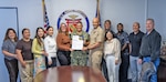 YOKOSUKA, Japan (Sept. 1, 2026) — Members of the U.S. Naval Hospital Yokosuka Clinical Quality Management Department pose with Capt. Donavon YapShing, deputy director of U.S. Naval Hospital Yokosuka and executive officer of U.S. Navy Medicine Readiness and Training Command Yokosuka, and a Joint Commission accreditation certificate. The recognition reflects the department’s role in supporting patient safety, clinical quality and continuous process improvement across the command. (U.S. Navy photo by Daniel Taylor, USNMRTC Yokosuka Public Affairs)
