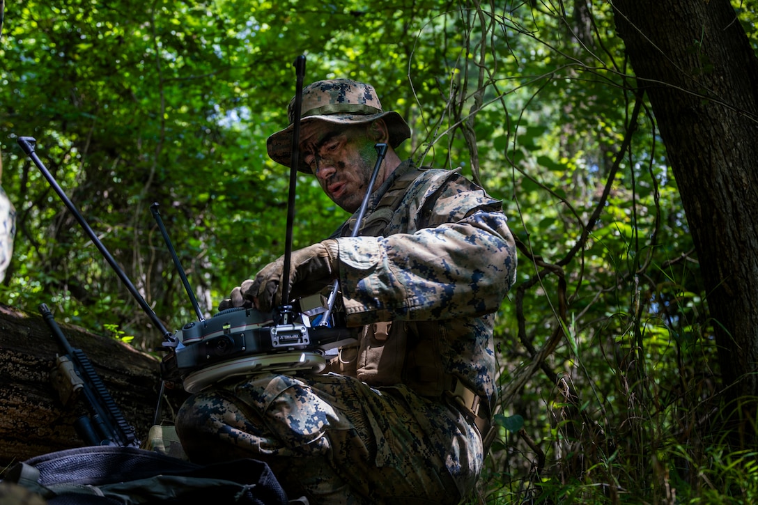 A U.S. Marine with Maritime Raid Force, 26th Marine Expeditionary Unit, sets up a Sky Raider drone while conducting a reconnaissance and surveillance exercise during a Multi-Domain Reconnaissance Course, Fort Eustis, Virginia, August 22, 2026. MDRC trains Marines assigned to the Multi Domain Task Unit and Maritime Raid Force with land, sea, air, cyber, and electronic warfare capabilities in preparation for the 26th MEU’s upcoming deployment. (U.S. Marine Corps photo by Cpl. Matthew Williams)