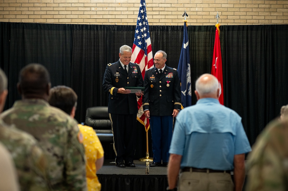 retirement ceremony, retiree standing with general officer