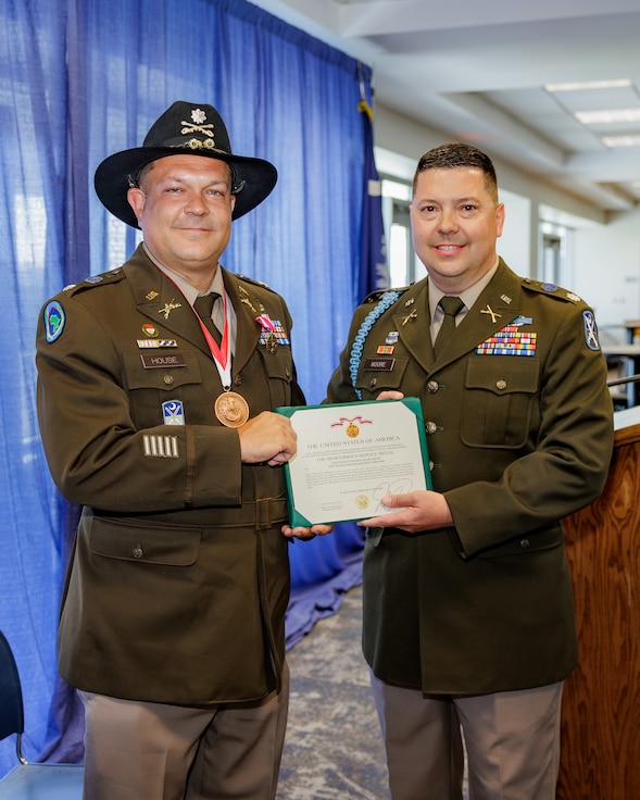 retirement ceremony holding retirement certificate