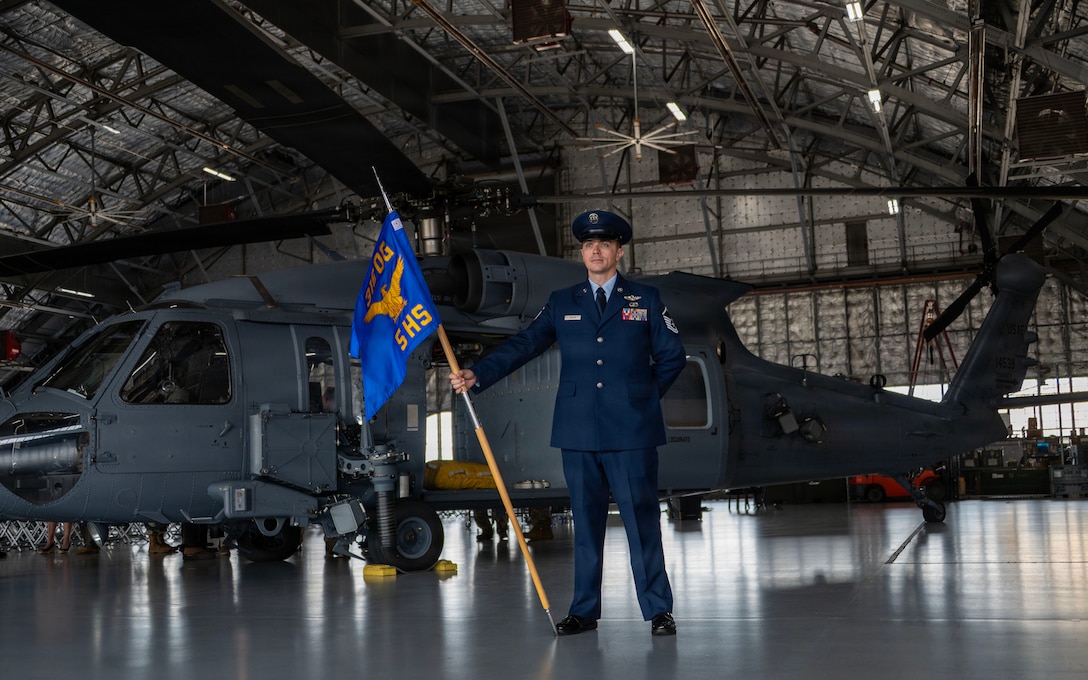 Master Sgt. John Griggs stands with the guidon during the 5th HS activation ceremony.