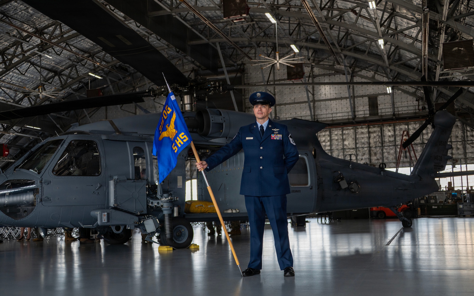 Master Sgt. John Griggs stands with the guidon during the 5th HS activation ceremony.