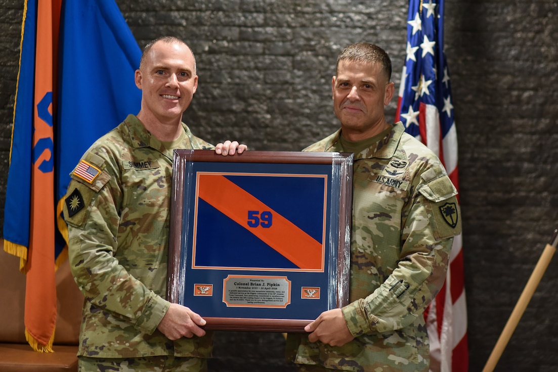 change of command ceremony soldier holding award