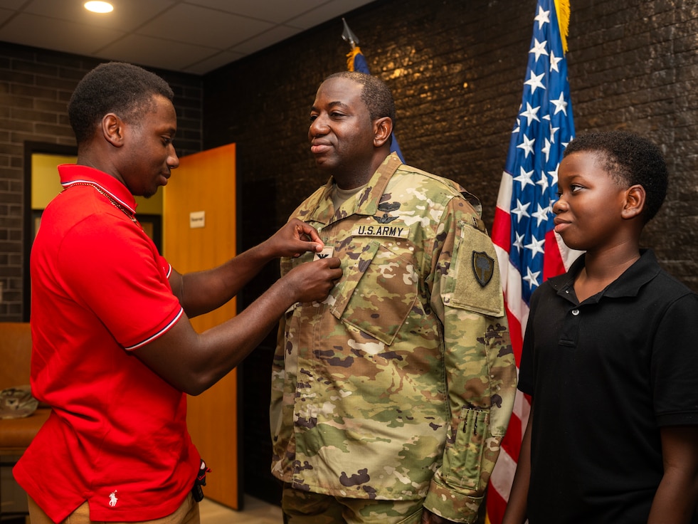 promotion ceremony family member pinning new rank
