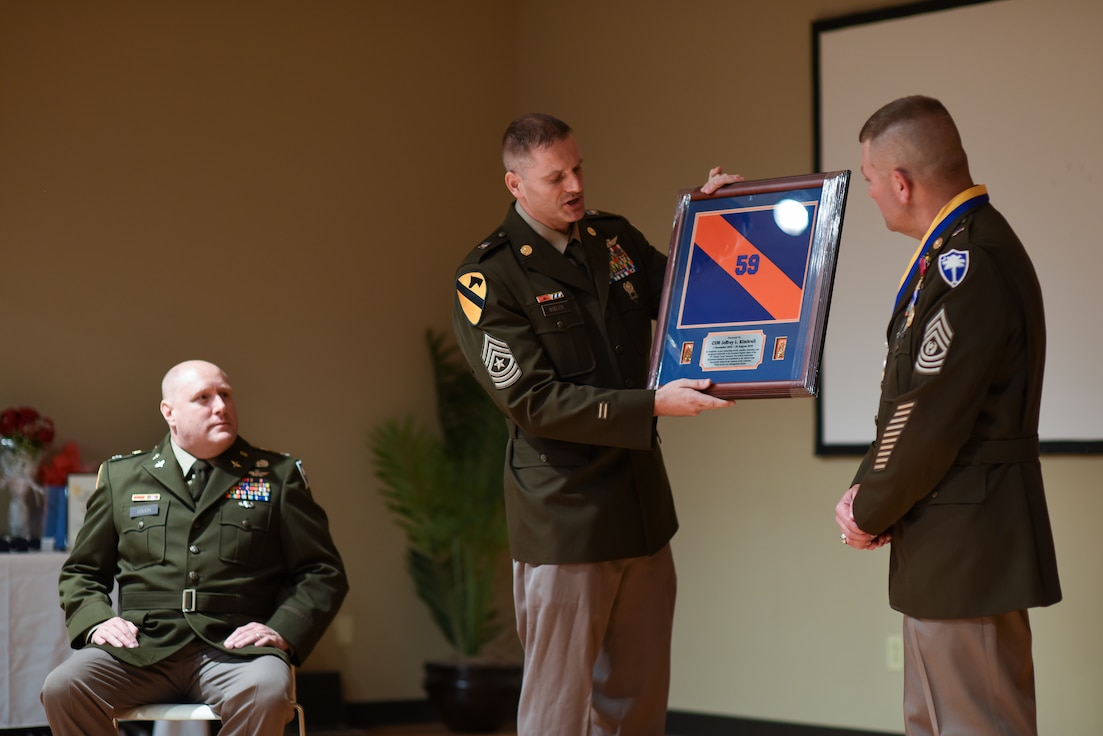 retirement ceremony retiree holding award