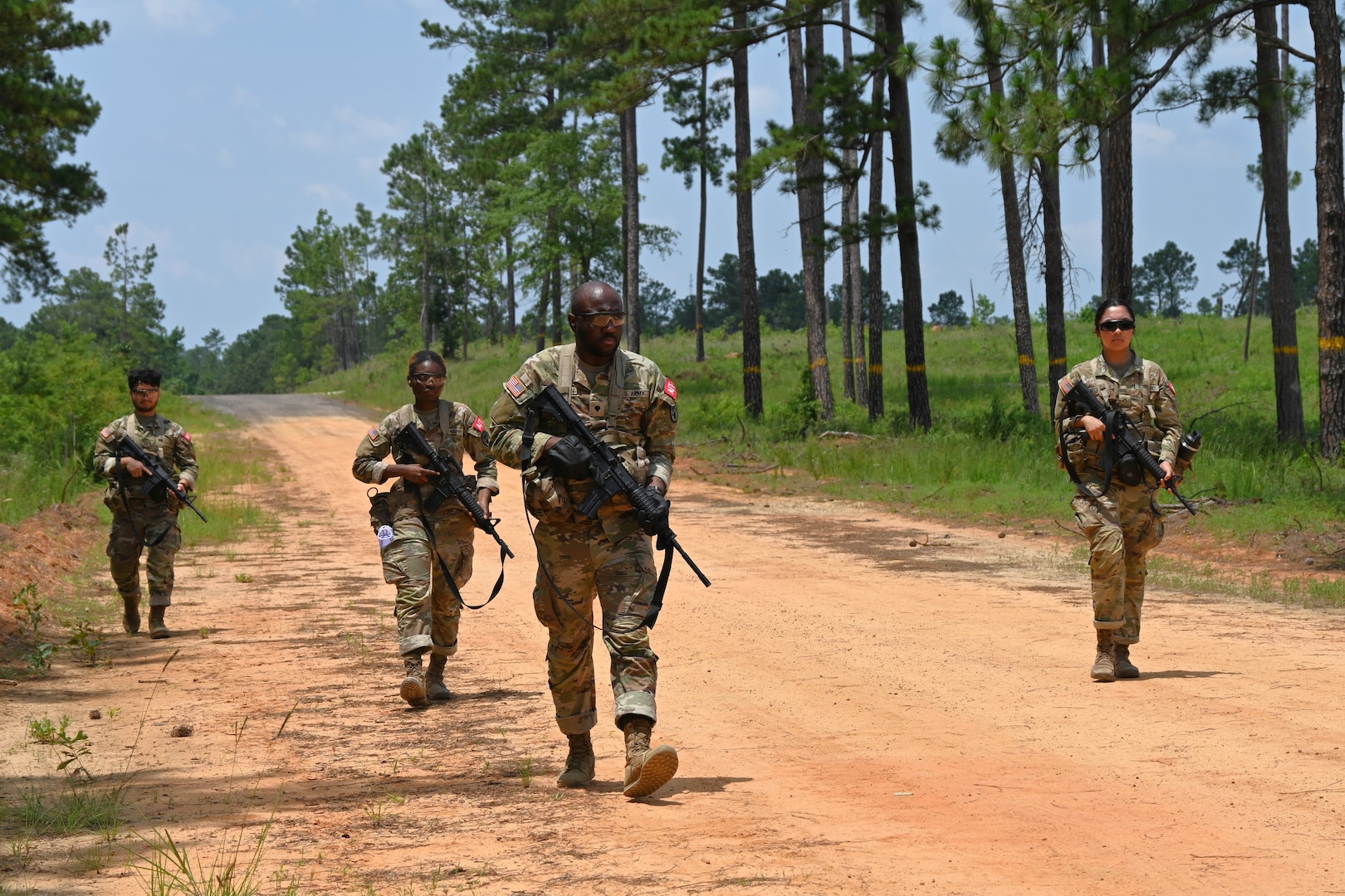 Soldiers in the field participating in a training exercise.