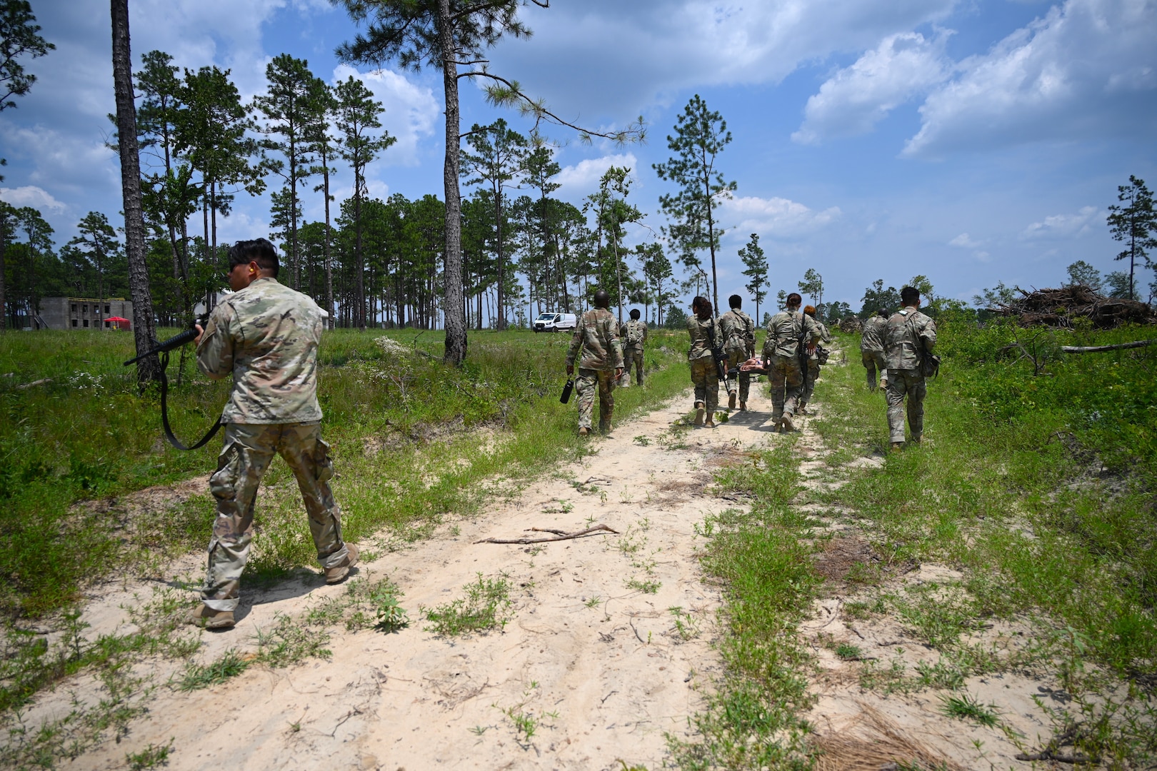Soldiers in the field participating in a training exercise.