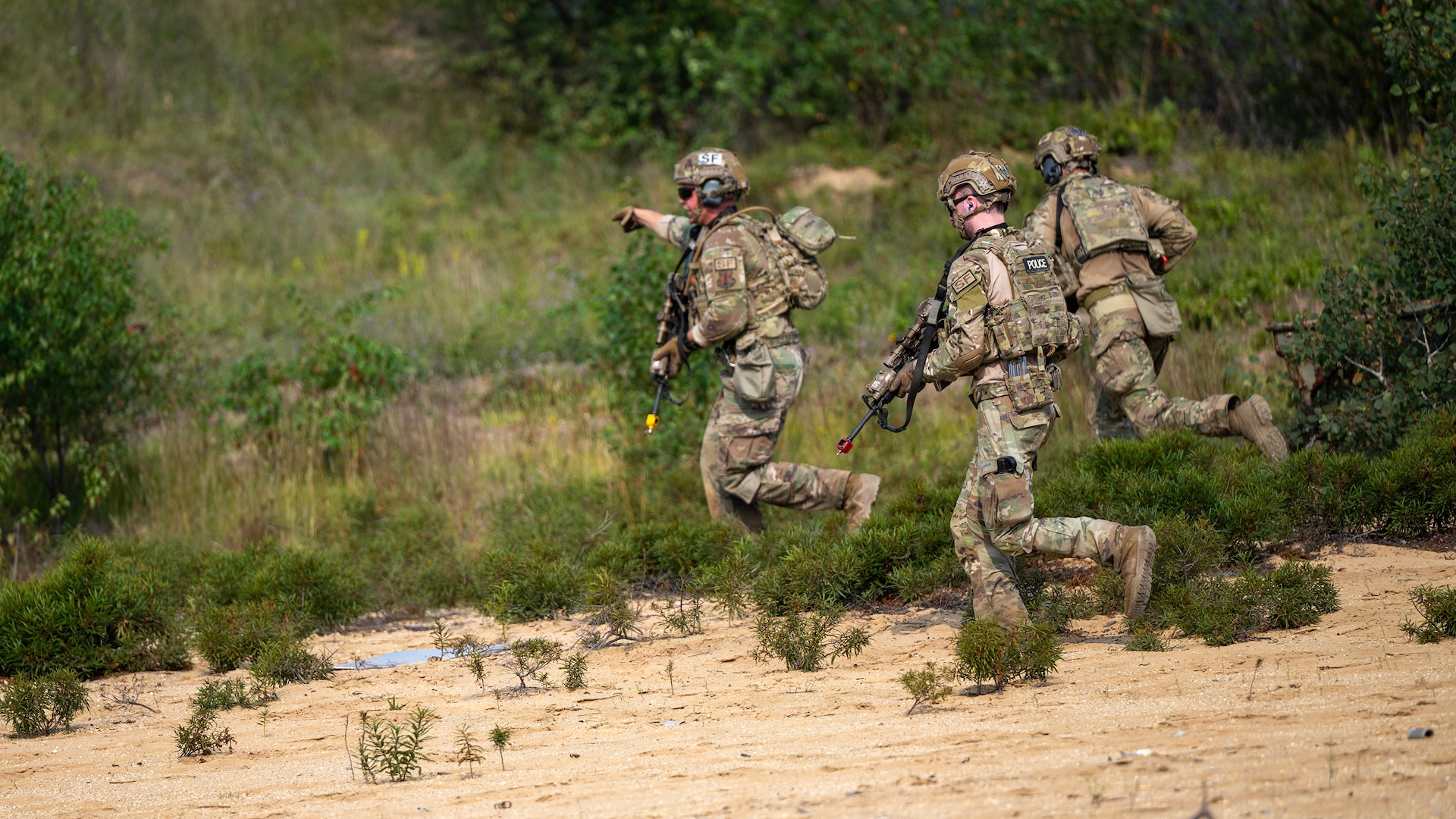 U.S. Air Force Security Forces Airmen with the Air National Guard, shoot, move and communicate toward a mission objective during exercise Sage Eagle 26-4, on Camp Grayling, Michigan, Aug. 11, 2026.
