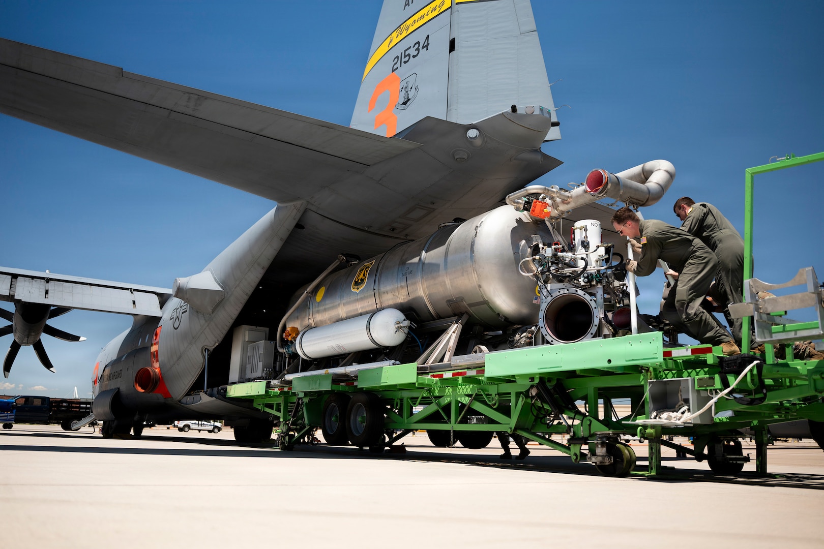 U.S. Air Force loadmasters assigned to the 153rd Airlift Wing guide a Modular Airborne Firefighting System, known as MAFFS, into the cargo bay of a C-130 Hercules at the 153rd Airlift Wing, Wyoming Air National Guard Base, in Cheyenne, Wyoming, July 13, 2026.