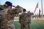Members of the 502d Air Base Wing salute as the U.S. flag is lowered to half-staff at Joint Base San Antonio-Fort Sam Houston Sept. 10, 2023, in honor of those lost in the terrorist attacks of Sept. 11, 2001. To commemorate the 25-year anniversary of the Sept. 11 attacks, Joint Base San Antonio-Fort Sam Houston is hosting a 9/11 Remembrance Ceremony at 7:46 a.m. on Friday, Sept. 11 at the Main Flagpole on Stanley Road.
