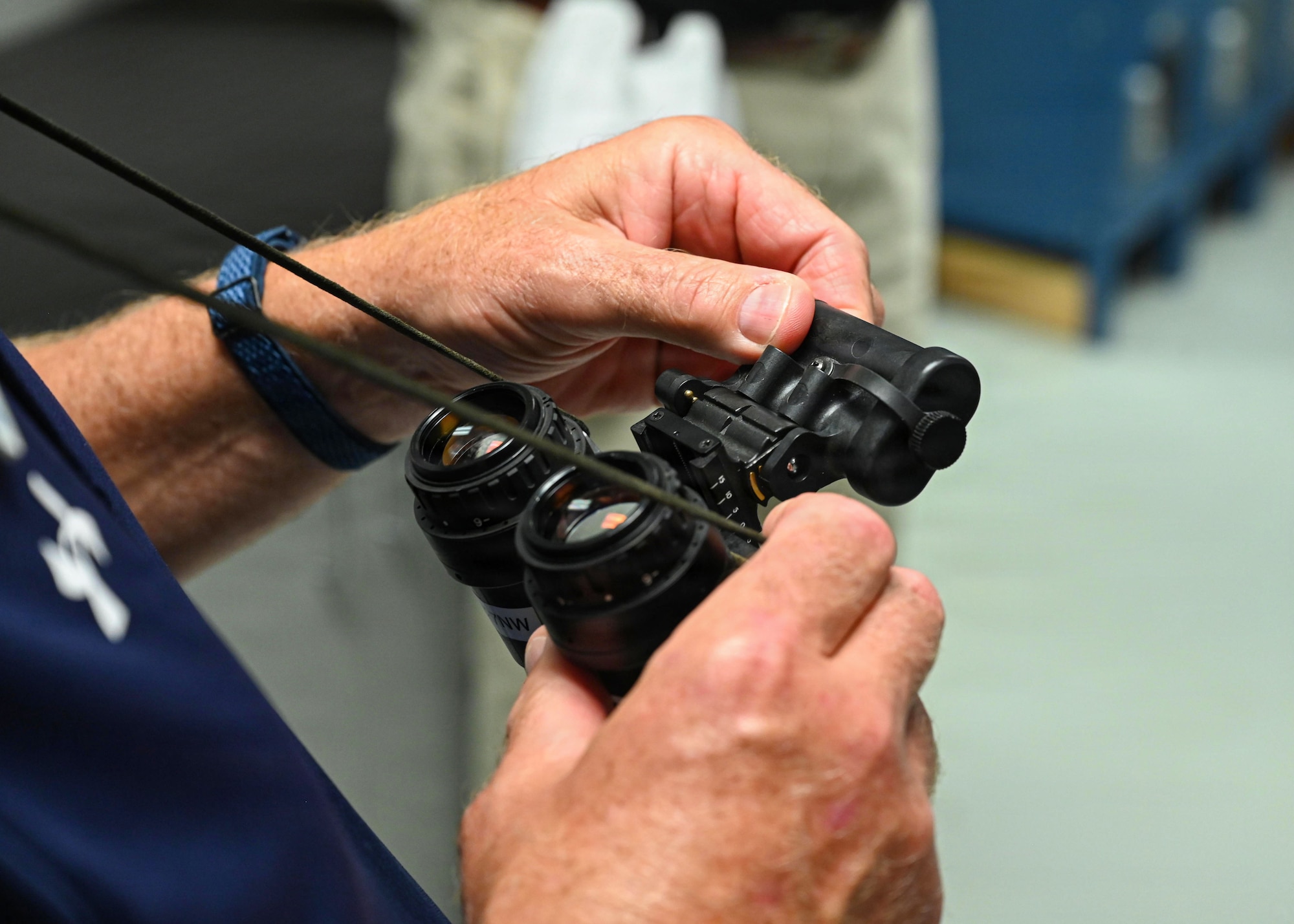 Man holding a pair of binoculars.
