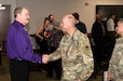Kevin Culihan shakes hands with Command Sgt. Maj. Andrew DeCola following Culihan’s retirement ceremony Aug. 31 at Fort Detrick, Maryland. Leaders from U.S. Arm Medical Logistics Command honored Culihan for nearly 50 years of combined federal service during the event.