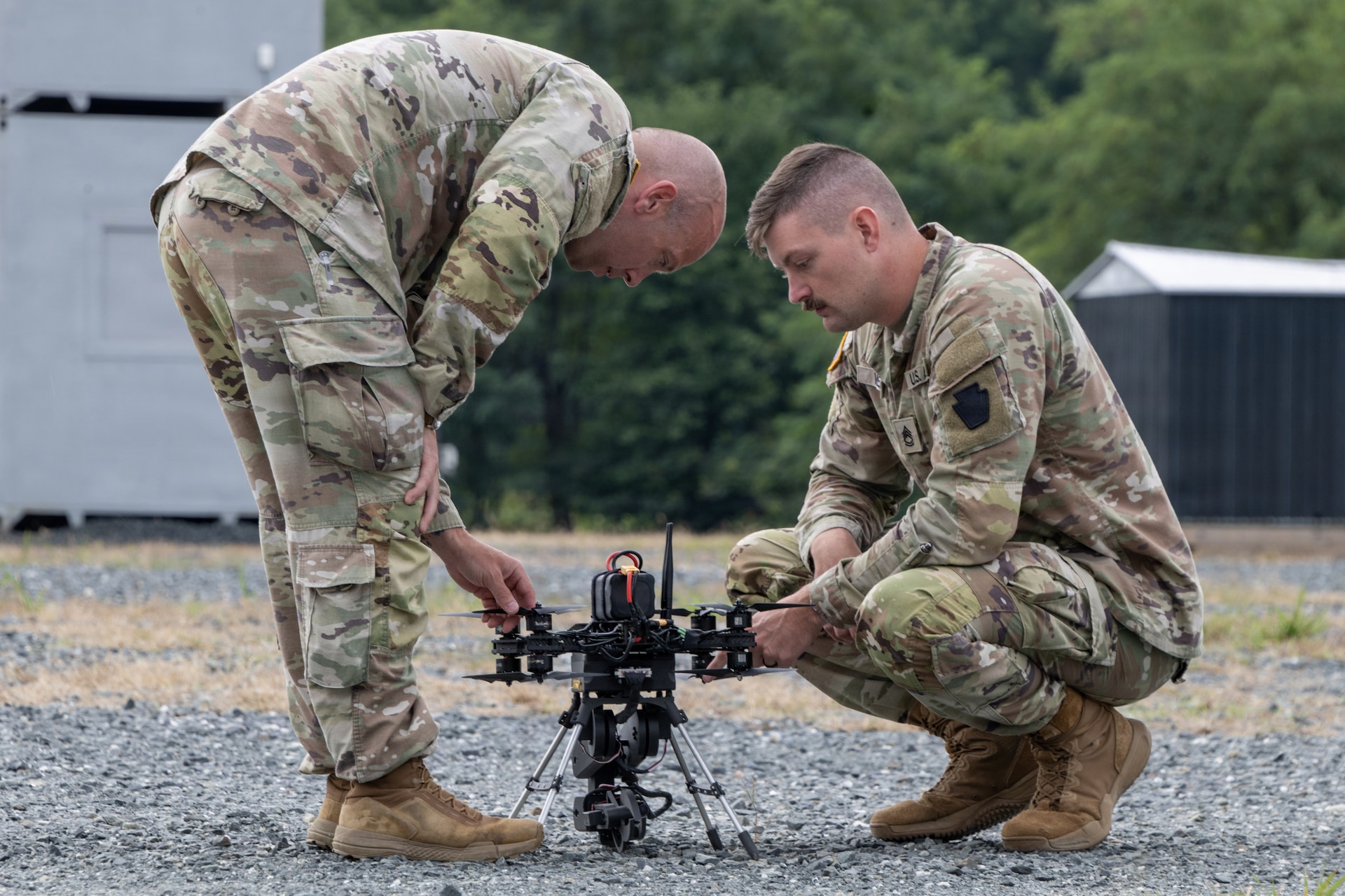 Chief Warrant Officer 2 Nathan Shea, left, and Sgt. 1st Class Brent Wehr of the Pennsylvania National Guard’s Unmanned Aircraft System Training and Innovation Facility prepare their Project R.E.D. drone for flight at U.S. Army Combat Capabilities Development Command’s Robotics and Autonomy Showcase Aug. 27, 2026, at Aberdeen Proving Ground, Maryland. (U.S. Army photo by Greg Newswanger)