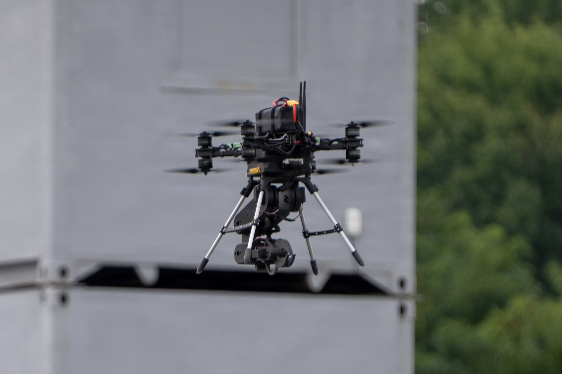 The Pennsylvania National Guard Unmanned Aircraft System Training and Innovation Facility's Project R.E.D. drone, with its mechanical arm stowed, hovers over another drone during U.S. Army Combat Capabilities Development Command’s Robotics and Autonomy Showcase Aug. 27, 2026, at Aberdeen Proving Ground, Maryland. (U.S. Army photo by Greg Newswanger)