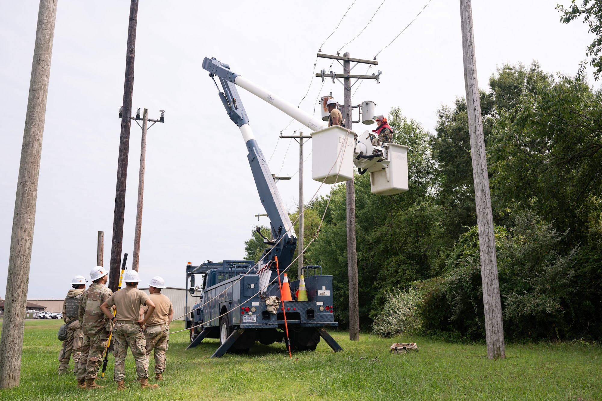 U.S. Air Force Airmen assigned to the 87th Civil Engineer Squadron prepare to ground simulated telephone poles during the 87th Civil Engineer Group Prime Beef readiness training at Joint Base McGuire-Dix-Lakehurst, N.J., Aug. 20, 2026.