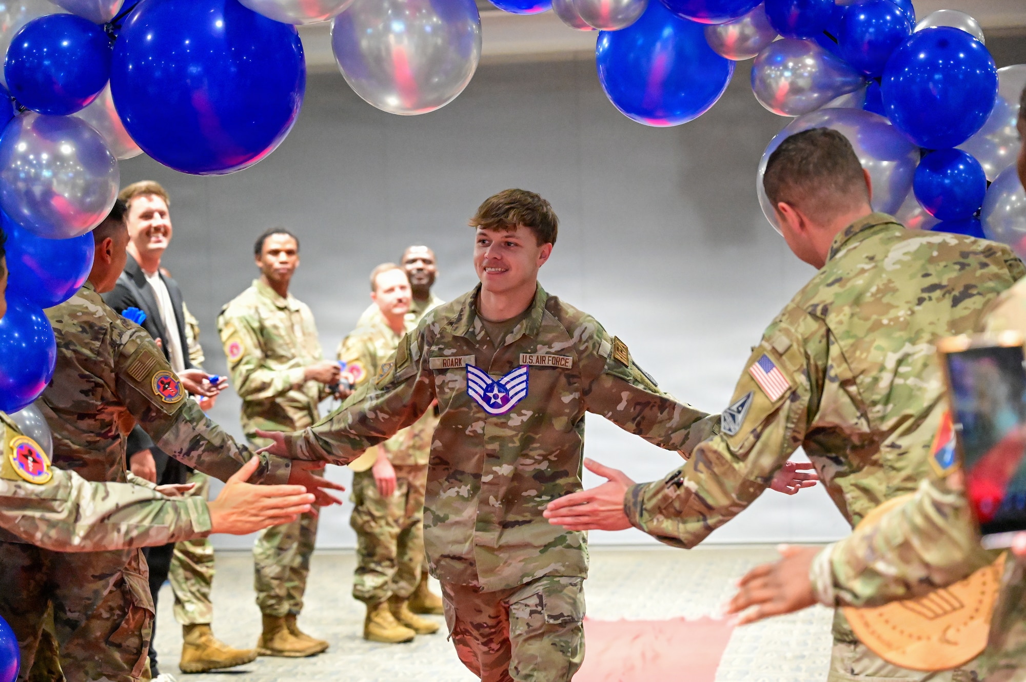 The event celebrated Airmen for their selection to the rank of staff sergeant (E-5), marking their welcome into the Noncommissioned Officer corps. In accordance with Air Force enlisted force structure, the transition to staff sergeant reflects an increased standard of technical competence, operational leadership, and direct supervision over junior Airmen.
