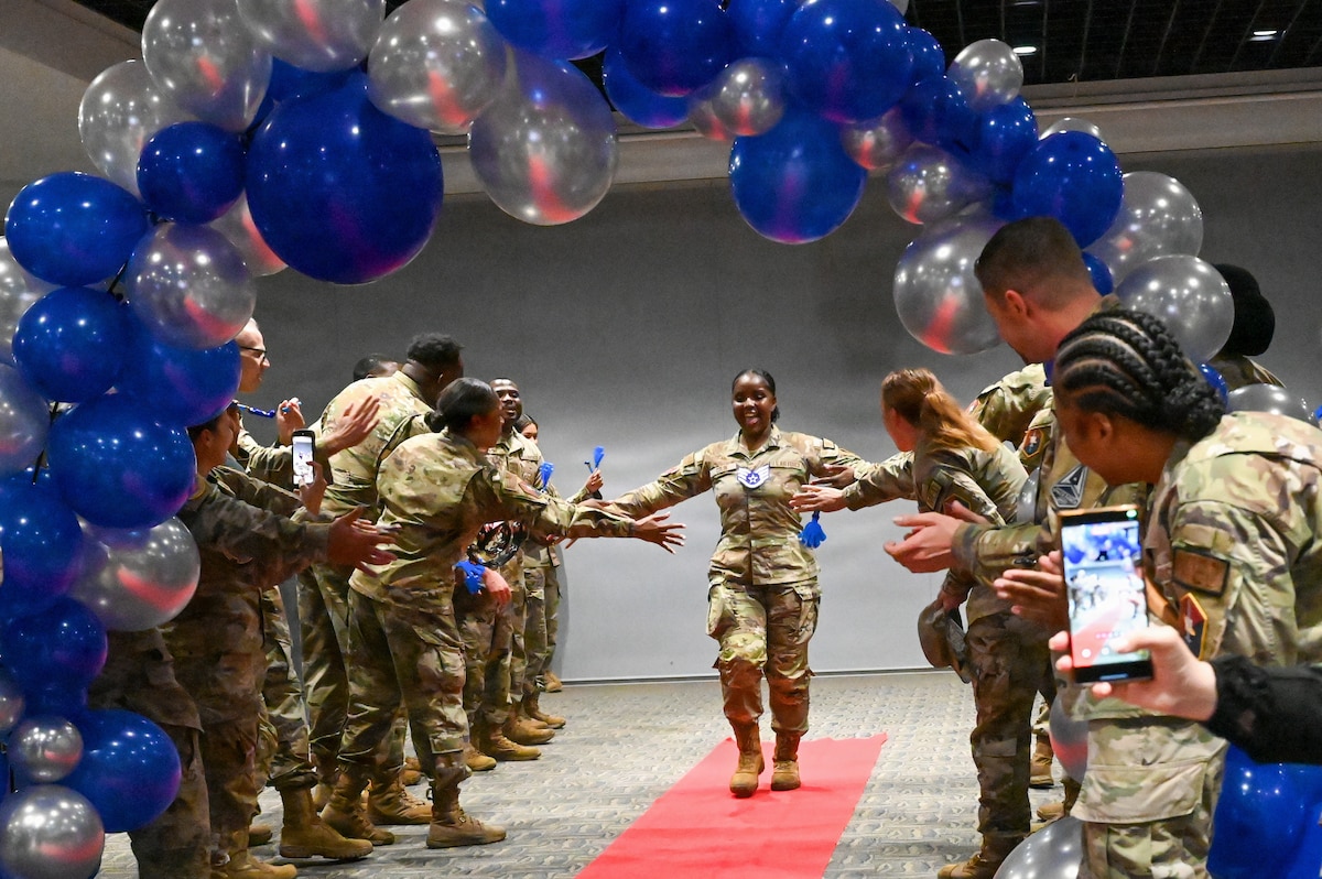 The event celebrated Airmen for their selection to the rank of staff sergeant (E-5), marking their welcome into the Noncommissioned Officer corps. In accordance with Air Force enlisted force structure, the transition to staff sergeant reflects an increased standard of technical competence, operational leadership, and direct supervision over junior Airmen.