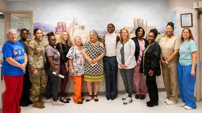 The pediatrics team takes a group picture together.