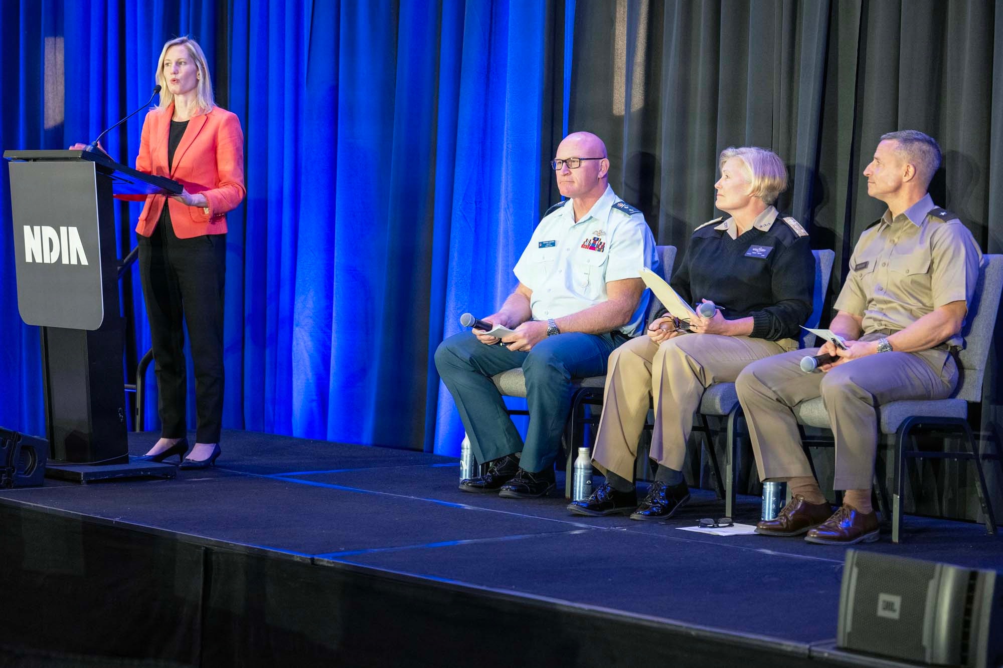 From left to right, Kate Watts, Maj. Gen. Kyle C. Paul, Vice Adm. Heidi Berg and Brig. Gen. Andrew R. Morgan participate on a panel during the 2026 Space Warfighter Forum.