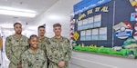 YOKOSUKA, Japan (June 17, 2026) — Sailors assigned to the U.S. Naval Hospital Yokosuka Dental Department pose with their Kaizen board. From left, Hospital Corpsman 3rd Class Bowen, Hospital Corpsman 3rd Class Harris, Hospitalman Ruiz and Hospital Corpsman 3rd Class Schwander earned first place in USNMRTC Yokosuka’s “Most Creative Kaizen Board” competition. Hospital Corpsman 2nd Class Cedillos and Hospitalman Willis are not pictured. (U.S. Navy photo by Daniel Taylor, USNMRTC Yokosuka Public Affairs)