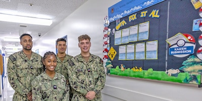 YOKOSUKA, Japan (June 17, 2026) — Sailors assigned to the U.S. Naval Hospital Yokosuka Dental Department pose with their Kaizen board. From left, Hospital Corpsman 3rd Class Bowen, Hospital Corpsman 3rd Class Harris, Hospitalman Ruiz and Hospital Corpsman 3rd Class Schwander earned first place in USNMRTC Yokosuka’s “Most Creative Kaizen Board” competition. Hospital Corpsman 2nd Class Cedillos and Hospitalman Willis are not pictured. (U.S. Navy photo by Daniel Taylor, USNMRTC Yokosuka Public Affairs)