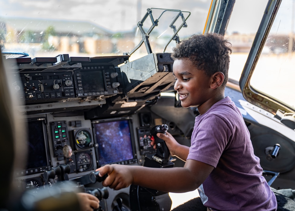 A child explores the controls from the pilot’s seat of a U.S. Air Force C-17 Globemaster III aircraft at Altus Air Force Base, Oklahoma, Aug. 31, 2026. As a part of the 70th anniversary of the U.S. Air Force KC-135 Stratotanker aircraft, Altus AFB had the opportunity to welcome families, friends and community members with base access, to explore static displays of Altus’ three aircraft. (U.S. Air Force photo by Airman 1st Class Emma Wright)