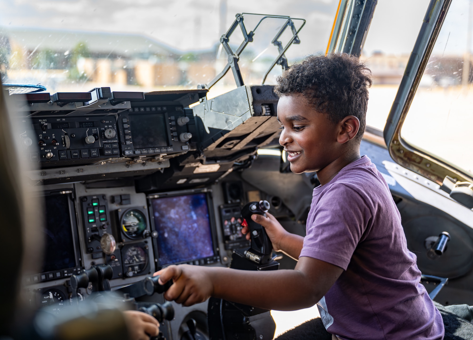 A child explores the controls from the pilot’s seat of a U.S. Air Force C-17 Globemaster III aircraft at Altus Air Force Base, Oklahoma, Aug. 31, 2026. As a part of the 70th anniversary of the U.S. Air Force KC-135 Stratotanker aircraft, Altus AFB had the opportunity to welcome families, friends and community members with base access, to explore static displays of Altus’ three aircraft. (U.S. Air Force photo by Airman 1st Class Emma Wright)