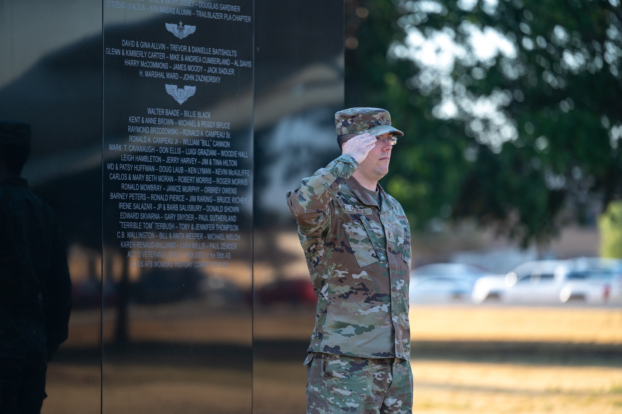 U.S. Air Force Capt. Philip O’Neill, 97th Air Mobility Wing chaplain, salutes the colors during the Boom Operator Memorial Ceremony at Altus Air Force Base, Oklahoma, Sept. 1, 2026. The memorial honored boom operators who gave their lives in service to their country. (U.S. Air Force photo by Senior Airman Kari Degraffenreed)