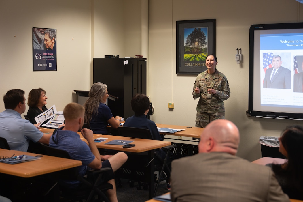 U.S. Air Force Tech. Sgt. Ingrid Ramirez, 17th Training Wing Safety occupational manager, briefs honorary commanders during a Wing Staff Agencies immersion at Goodfellow Air Force Base, Texas, Aug. 28, 2026. The 17th TRW Safety office promotes a healthy and efficient culture of safety compliance, regulatory guidelines and risk management to protect assets, material and most of all, personnel. (U.S. Air Force photo by Senior Airman Brian Lummus)