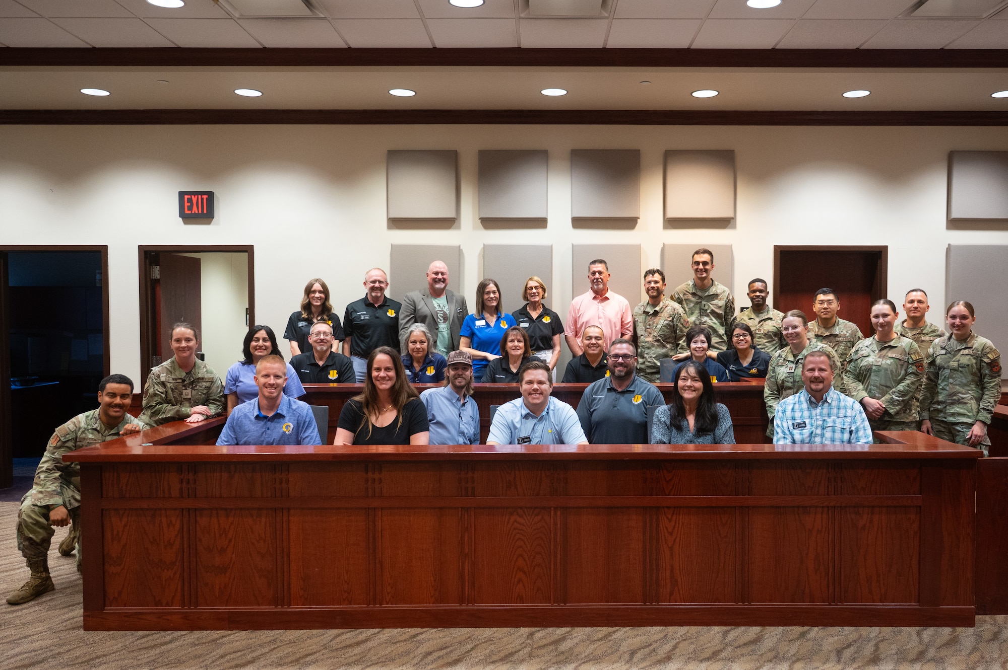 The 2025-2026 class of honorary commanders pose for a group photo with Wing Staff Agencies personnel after participating in a mock trial at Goodfellow Air Force Base, Texas, Aug. 28, 2026. The Honorary Commander Program gives community members insight on the importance of the 17th Training Wing, the Air Force mission and the Department of War through direct interactions with military commanders and their units. (U.S. Air Force photo by Senior Airman Brian Lummus)