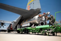 U.S. Air Force loadmasters assigned to the 153rd Airlift Wing guide a Modular Airborne Firefighting System, known as MAFFS, into the cargo bay of a C-130 Hercules at the 153rd Airlift Wing, Wyoming Air National Guard Base, in Cheyenne, Wyoming, July 13, 2026.