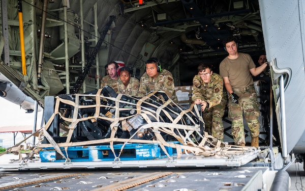 U.S. Air Force Airmen assigned to the 374th Airlift Wing, offload life-saving supplies from a C-130J Super Hercules, assigned to the 36th Airlift Squadron, Yokota Air Base, Japan, at Tribhuvan International Airport, Nepal, Sept. 2, 2026.