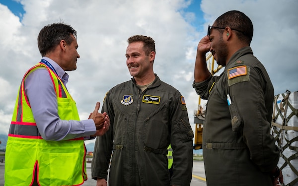 From left, U.S. Embassy Nepal Chargé d’Affaires Scott Urbom speaks with U.S. Air Force Capt. Jacob Carley and U.S. Air Force Maj. Jay Lambert, both 36th Airlift Squadron pilots, at Tribhuvan International Airport, Nepal, Sept. 2, 2026, following the delivery of life-saving supplies.