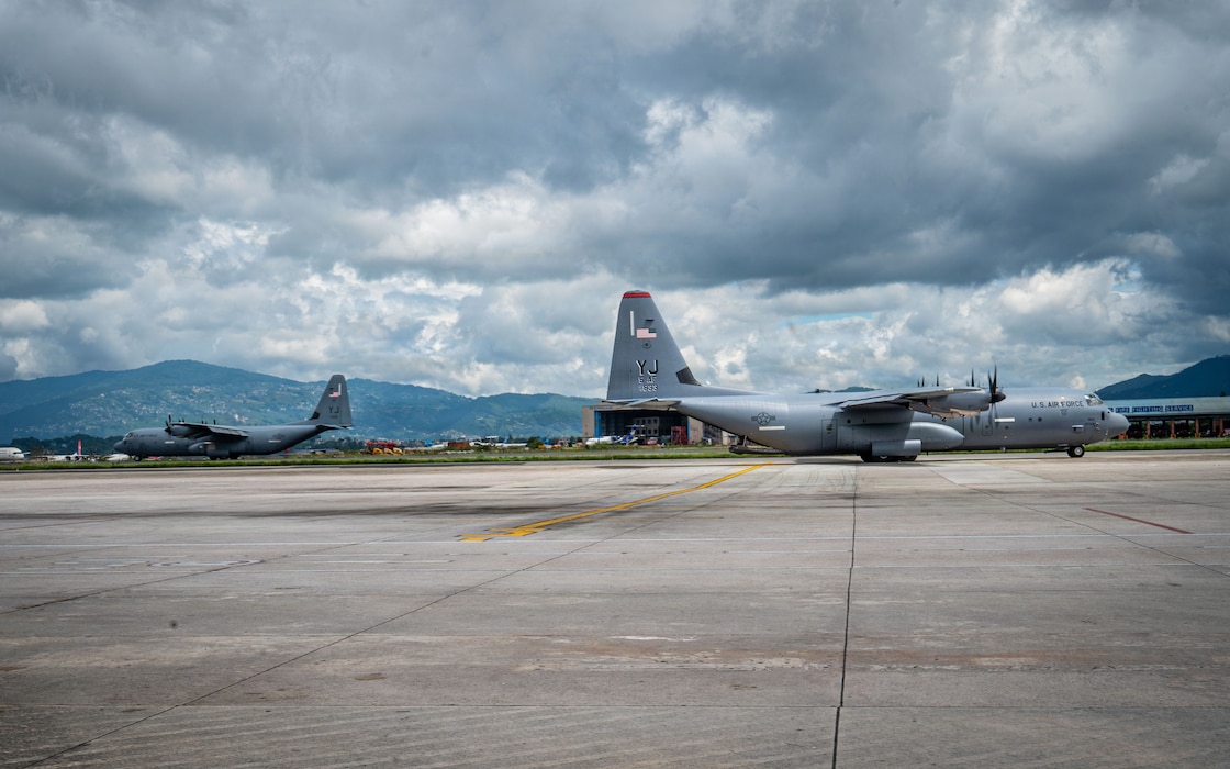 One U.S. Air Force C-130J Super Hercules, assigned to the 36th Airlift Squadron, Yokota Air Base, Japan, arrives on the flight line, as the other departs Tribhuvan International Airport, Nepal, Sept. 2, 2026, after delivering life-saving aid and supplies.