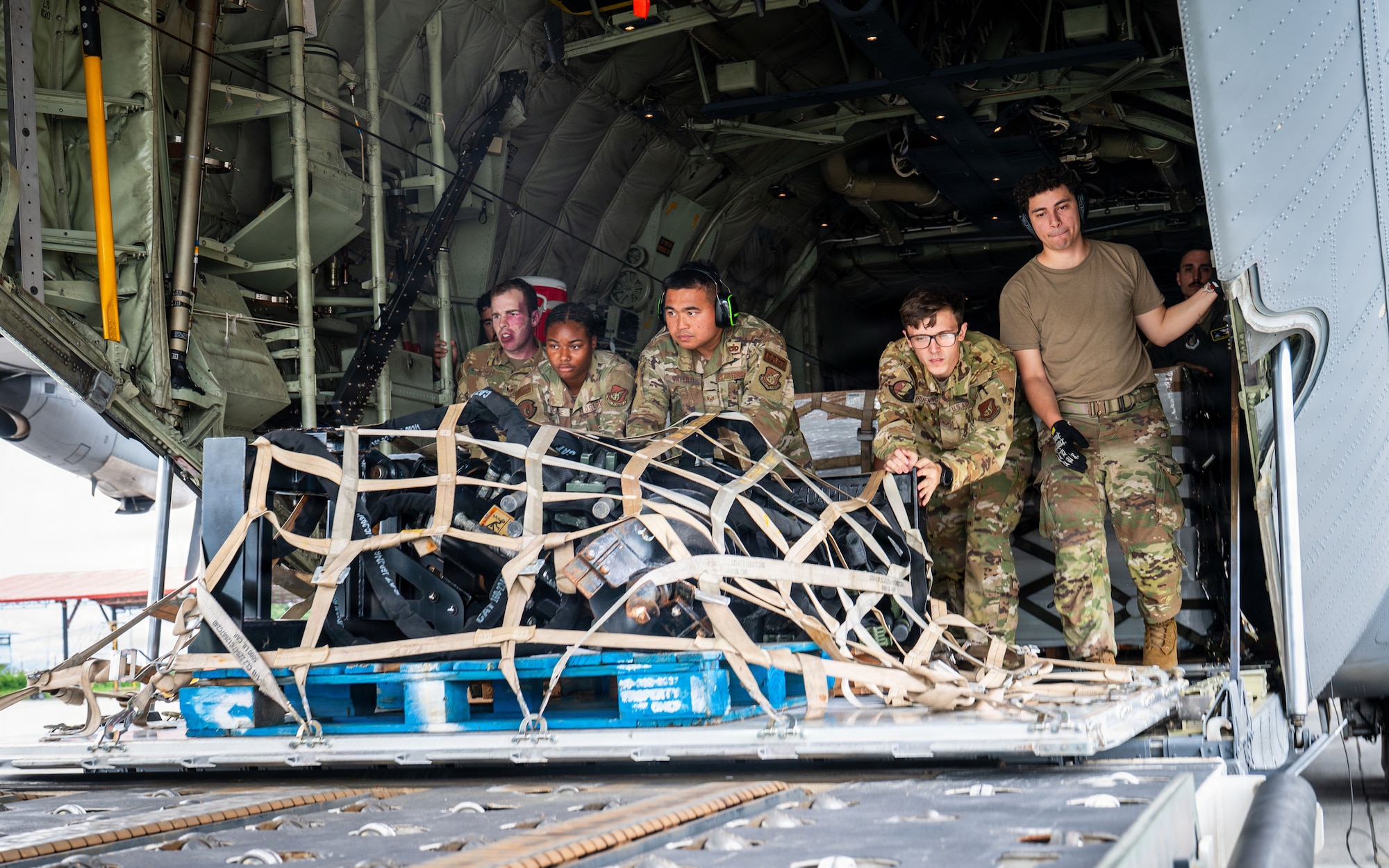 U.S. Air Force Airmen assigned to the 374th Airlift Wing, offload life-saving supplies from a C-130J Super Hercules, assigned to the 36th Airlift Squadron, Yokota Air Base, Japan, at Tribhuvan International Airport, Nepal, Sept. 2, 2026.