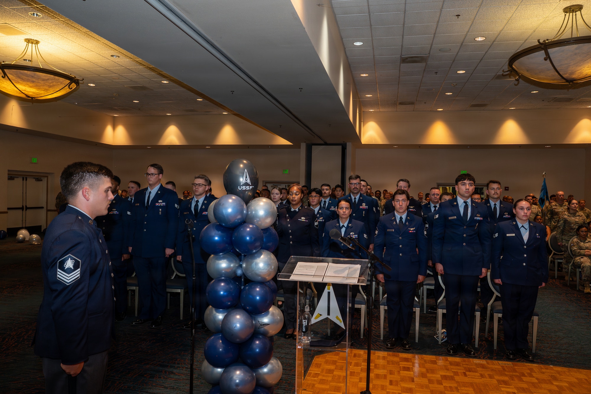 People stand from their seats