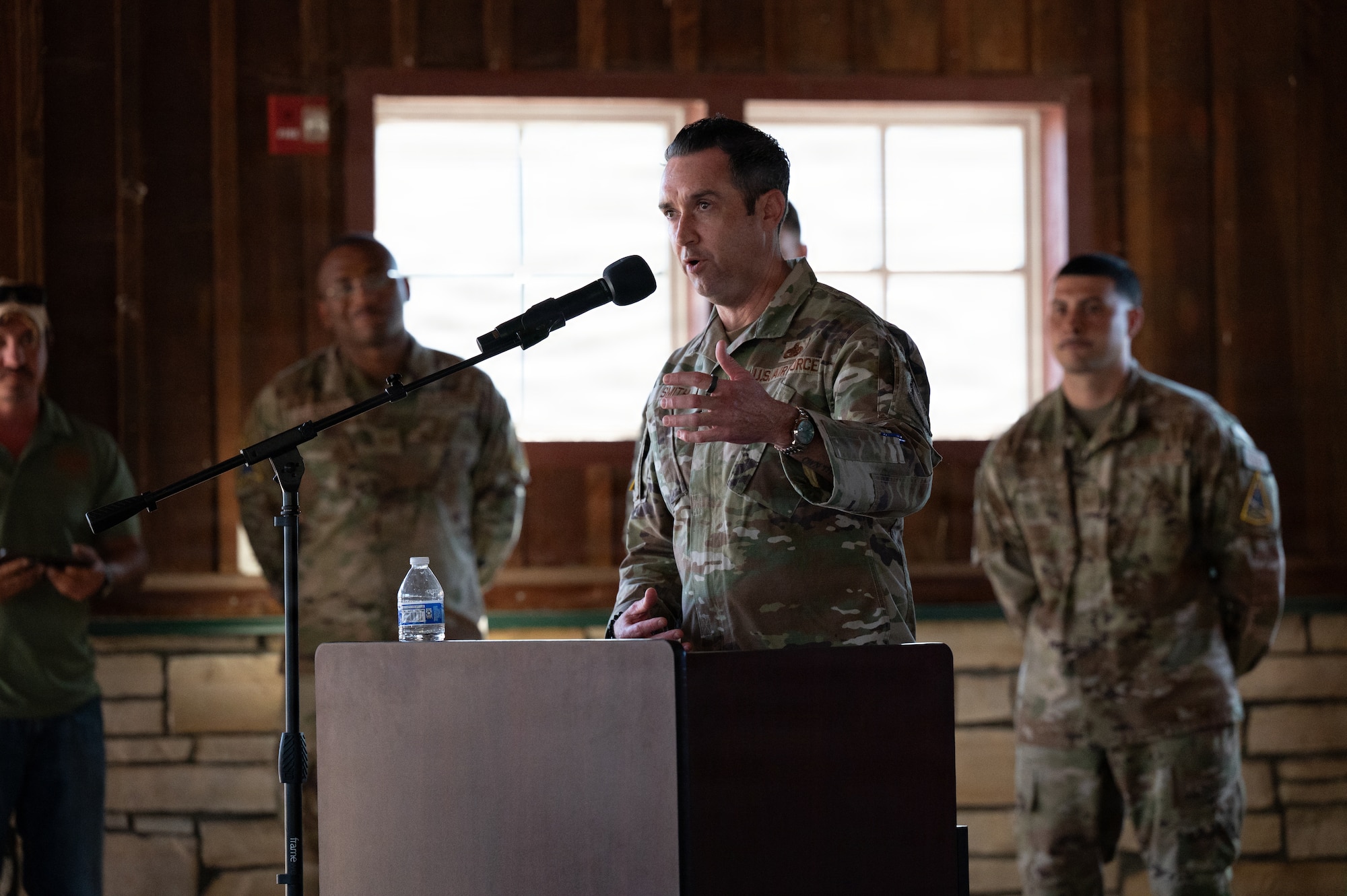 A man speaks at a podium.