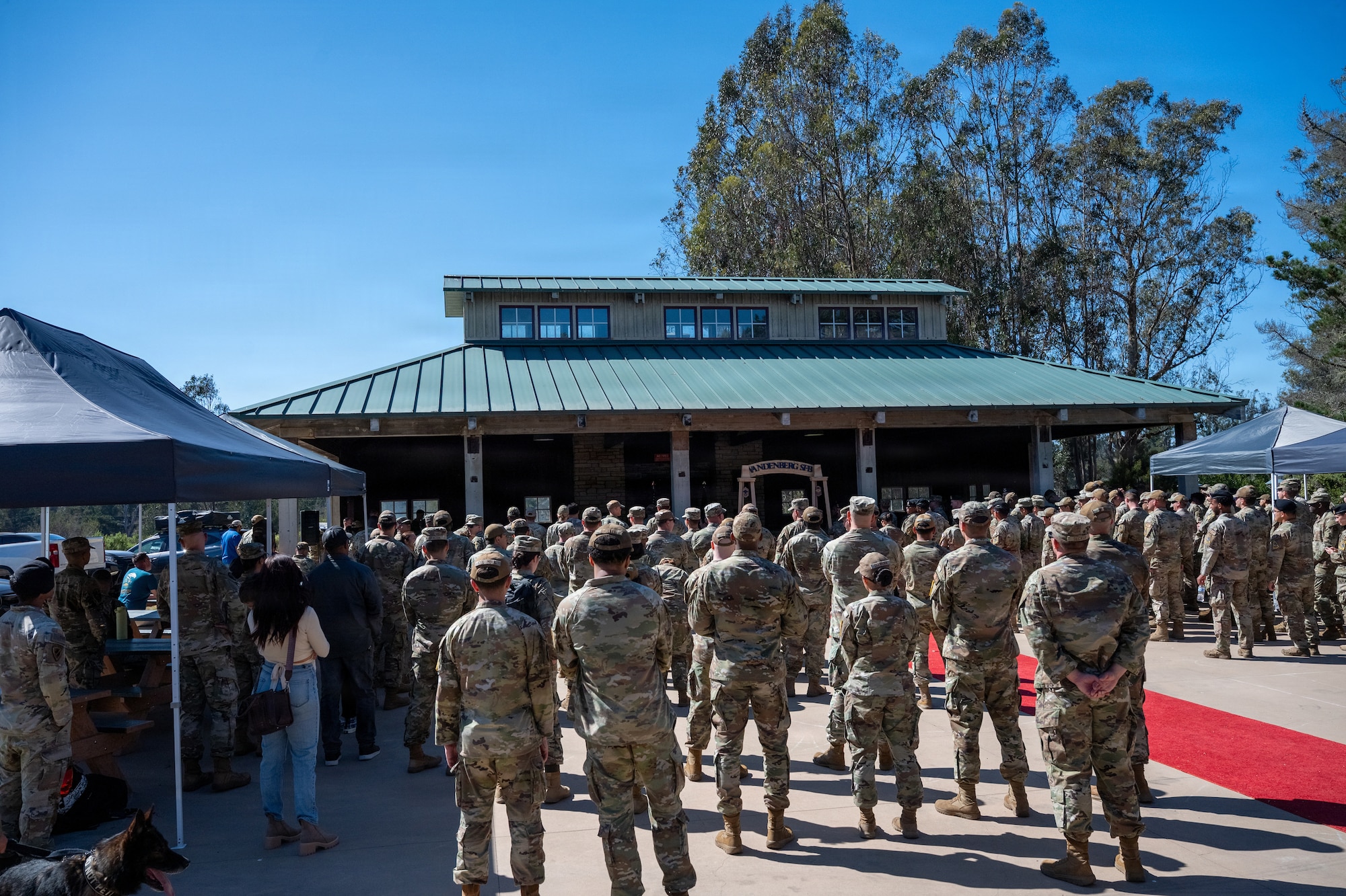 People stand outside a pavilion.