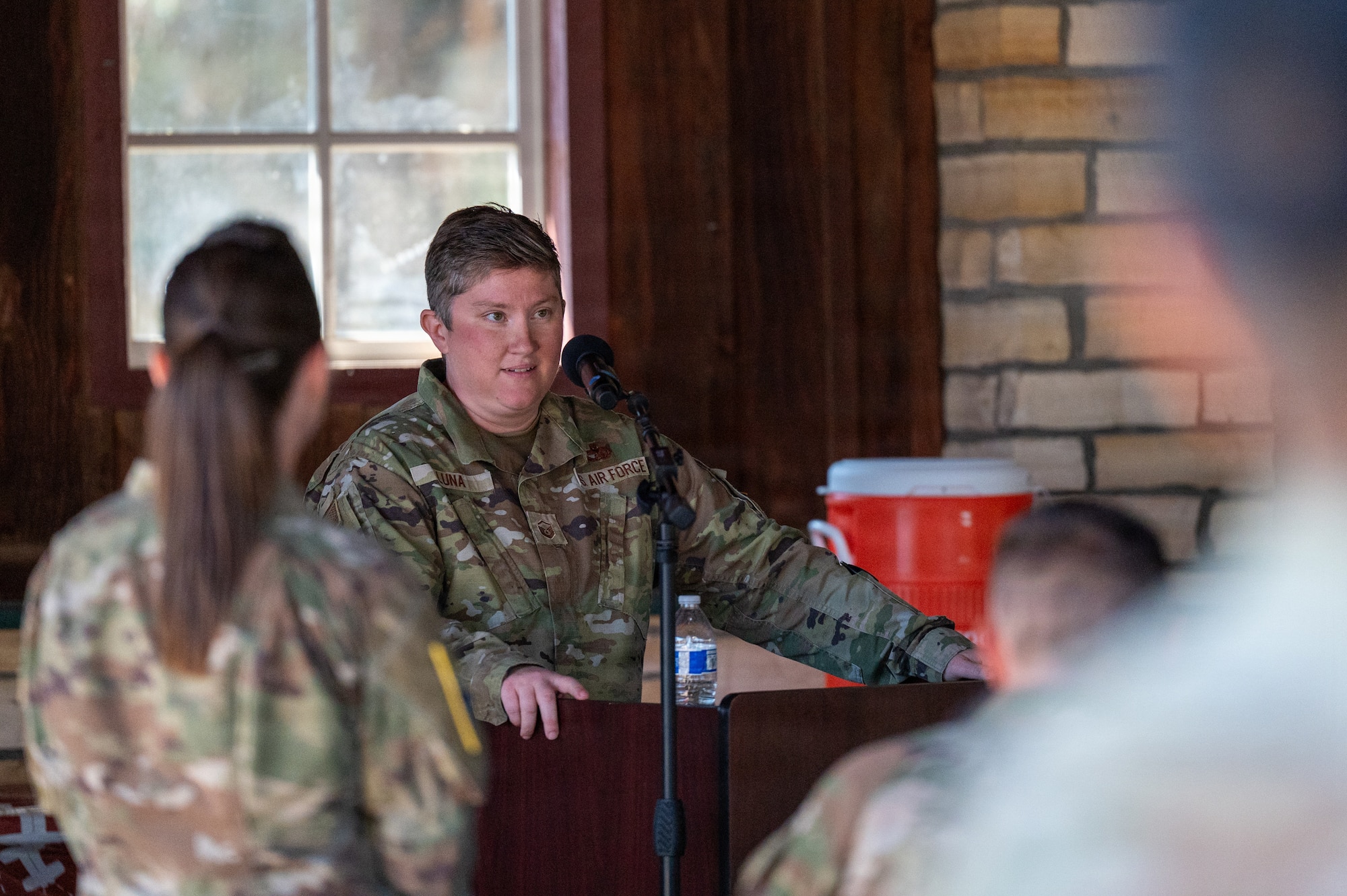 A woman speaks at a podium.