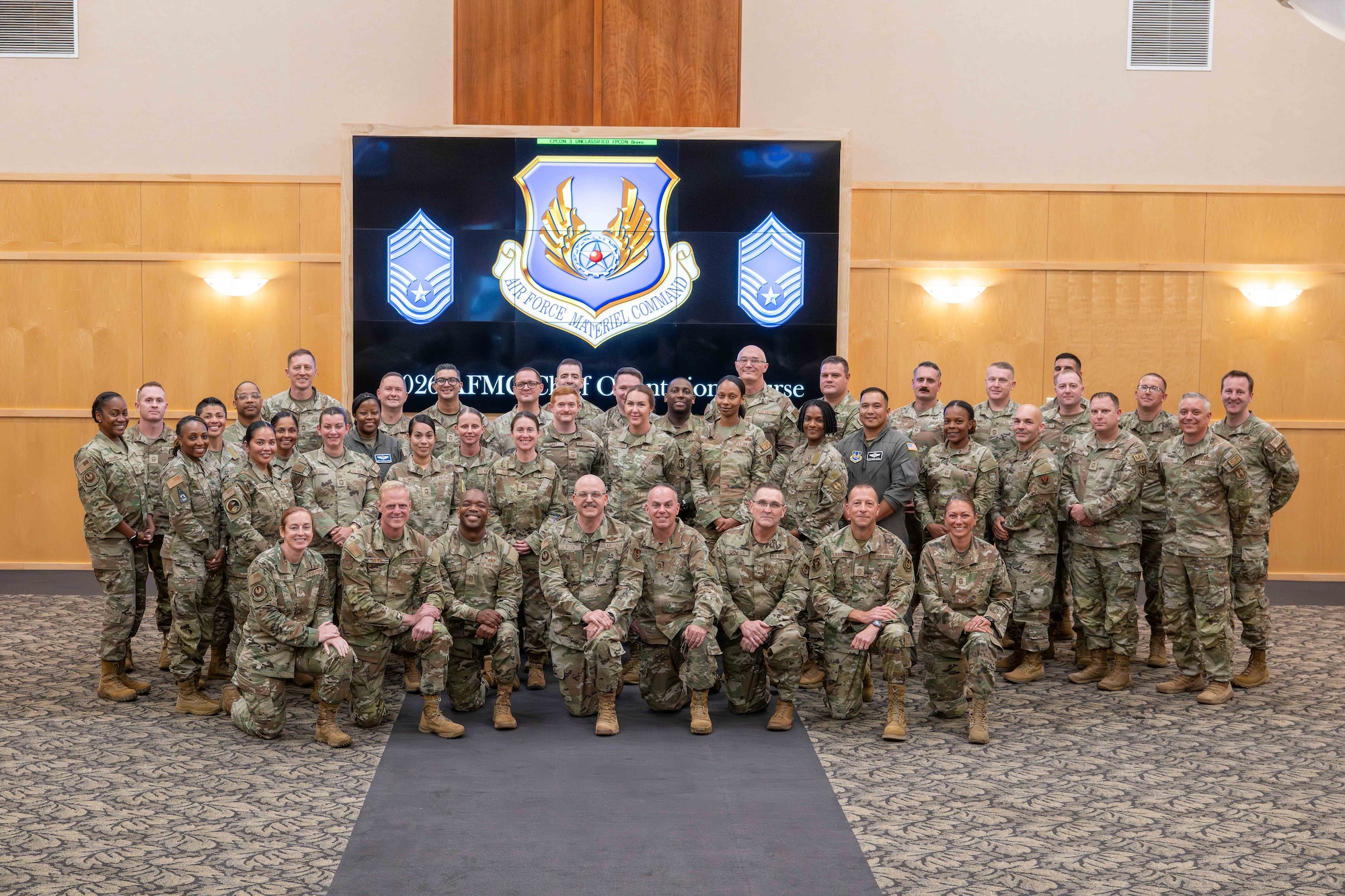Chief Master Sergeants from across the Air Force Material Command at the AFMC Chief Orientation Course pose for a group photo.