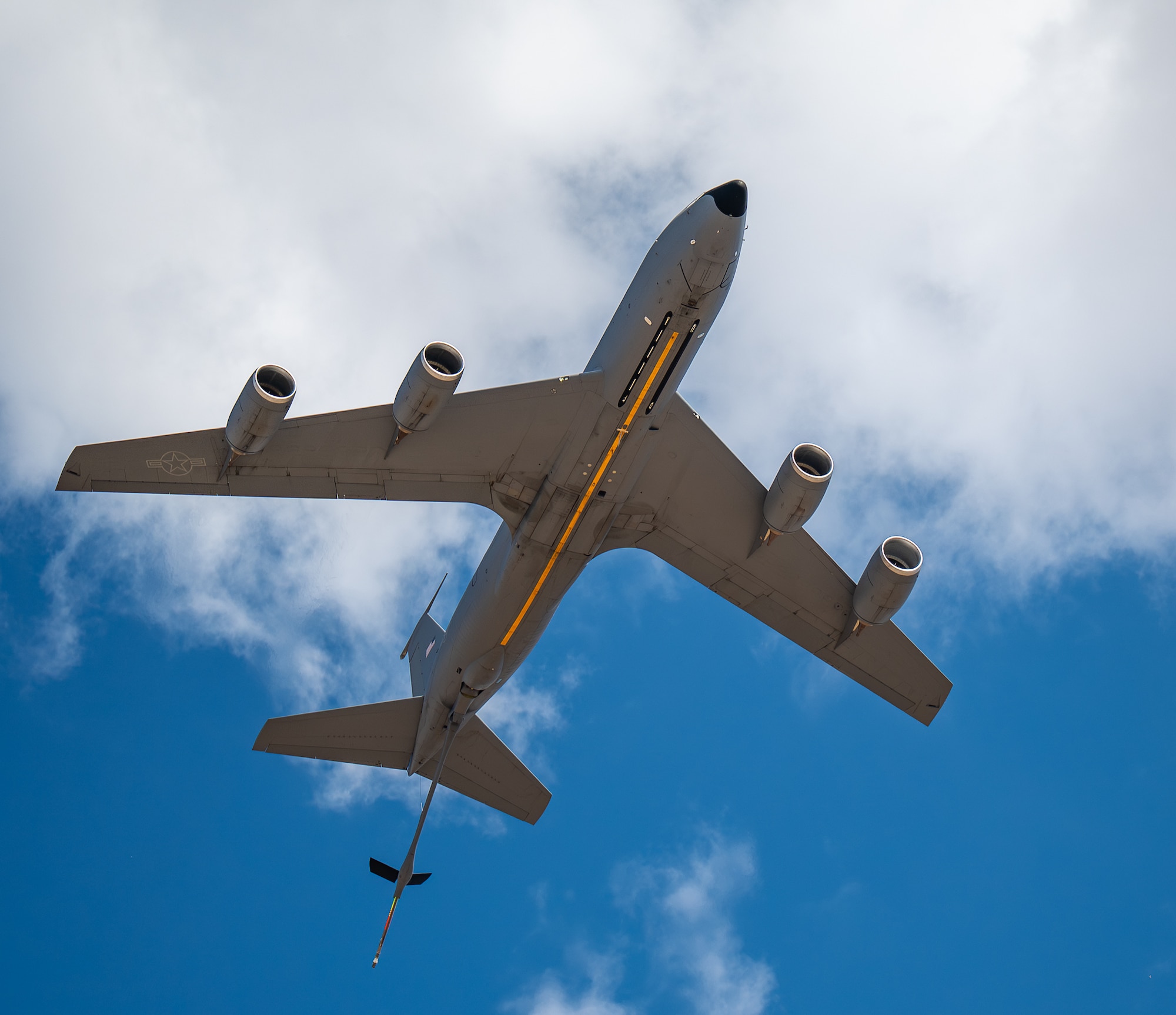 A U.S. Air Force KC-135 Stratotanker aircraft flies over aircraft static displays at Altus Air Force Base, Oklahoma, Aug. 31, 2026. Airmen, families, and community members had the opportunity to tour a KC-135, KC-46 Pegasus, and C-17 Globemaster III aircraft. (U.S. Air Force photo by Airman 1st Class Emma Wright)