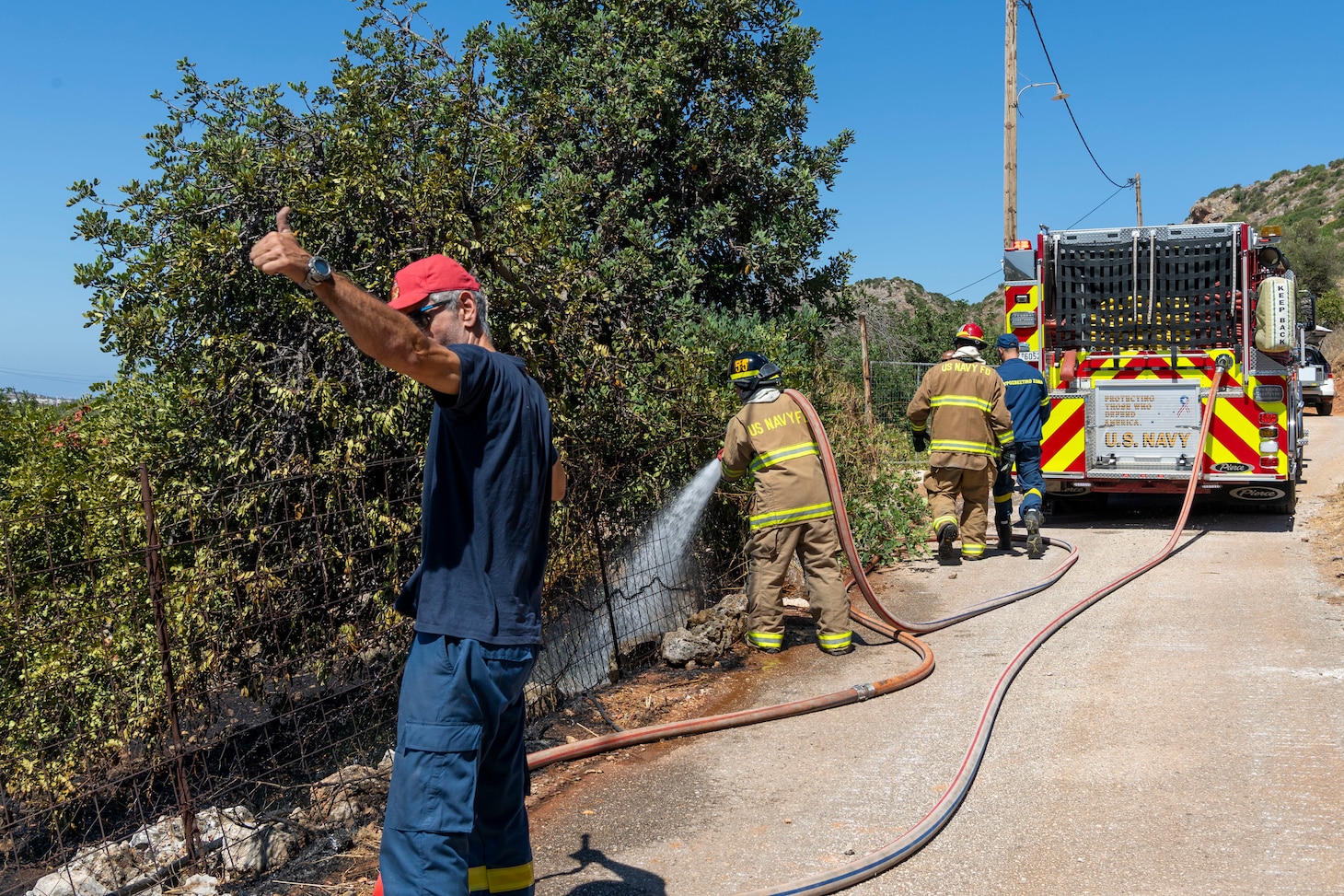 Firefighters from Naval Support Activity (NSA) Souda Bay Fire & Emergency Services and the host-nation Chania Fire Department respond to a brush fire near the installation in Mouzouras, Crete, Greece, Sept. 1, 2026.
