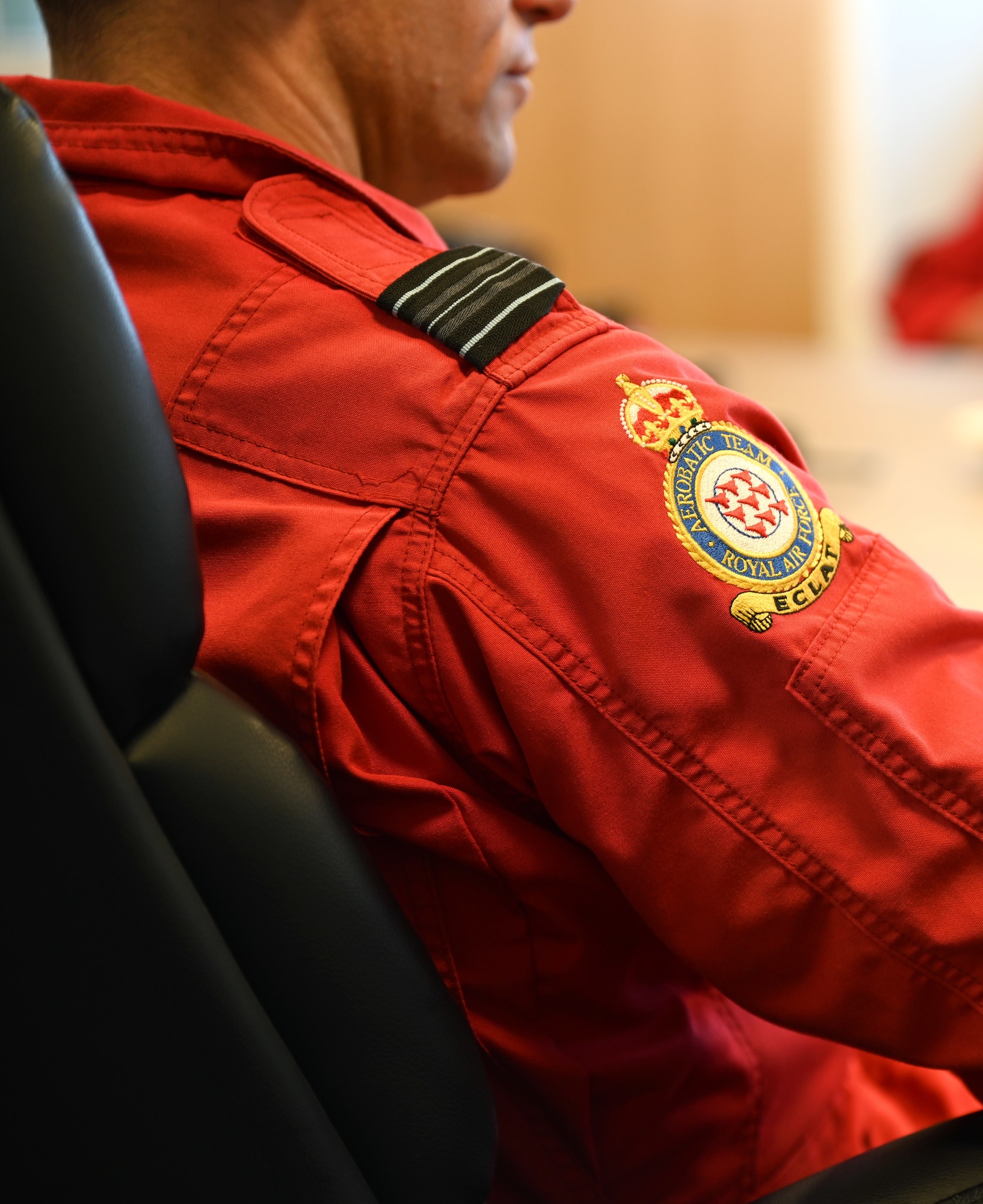 A Red Arrows pilot wears the official patch of the Royal Air Force Aerobatic Team during a stopover at RAF Mildenhall, England, Aug. 28, 2026. Team Mildenhall provided support to the team and their Hawk T1 aircraft while here. (U.S. Air Force photo by Karen Abeyasekere)