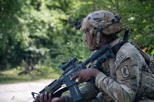 U.S. Army Sgt. Cjay Spence with Headquarters and Headquarters Company, 173rd Mobile Brigade Combat Team (Airborne), pulls security during exercise Saber Junction 26 at Joint Multinational Readiness Center's Hohenfels Training Area, Germany, Aug. 27, 2026. 7th Army Training Command provides a unique environment in Europe to develop leaders and formations prepared for large-scale combat operations while improving readiness. (U.S. Army photo by 1st Lt. Brandon Miles)