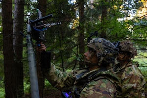 U.S. Soldiers assigned to the 173rd Mobile Brigade Combat Team, set up a Ground Control Station antenna during exercise Saber Junction 26 at the Hohenfels Training Area, Joint Multinational Readiness Center (JMRC), Germany, Aug. 29, 2026. JMRC's Combat Training Center rotations drive unrivaled innovation and readiness in the U.S. Army Europe and Africa area of operations. (U.S. Army Photo by SPC. Kaleb Lampkin)