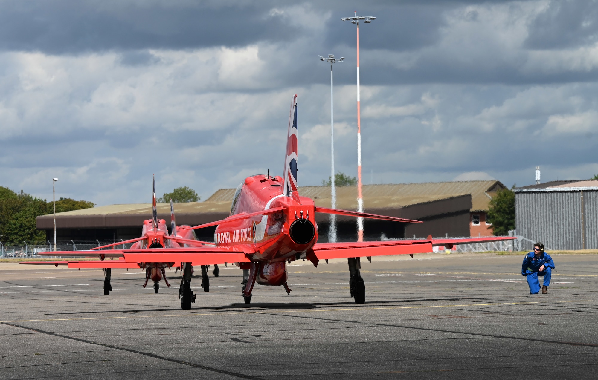 As they head out to an aerial display, the Royal Air Force Aerobatic Team, the Red Arrows, taxi their Hawk T1 aircraft along the flight line at RAF Mildenhall, England, Aug. 28, 2026. Team Mildenhall provided a wide range of support to the team during their flying visit as they performed at air shows around the UK. (U.S. Air Force photo by Karen Abeyasekere)