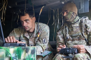U.S. Army Spc. Taylor Bruenger, left, and Pfc. Zachary Gardner, infantrymen with 3rd Battalion, 504th Parachute Infantry Regiment, 173rd Mobile Brigade Combat Team (Airborne), train with a Hornet, a military unmanned aircraft system, during exercise Saber Junction 26 at Joint Multinational Readiness Center's Hohenfels Training Area, Germany, Aug. 29, 2026. During Saber Junction 26, the U.S. Army is implementing its Continuous Transformation initiative, utilizing new technologies and systems designed to enhance its warfighting readiness and ability to respond to crisis or conflict. (U.S. Army Photo by SGT Marc Morgenstern)
