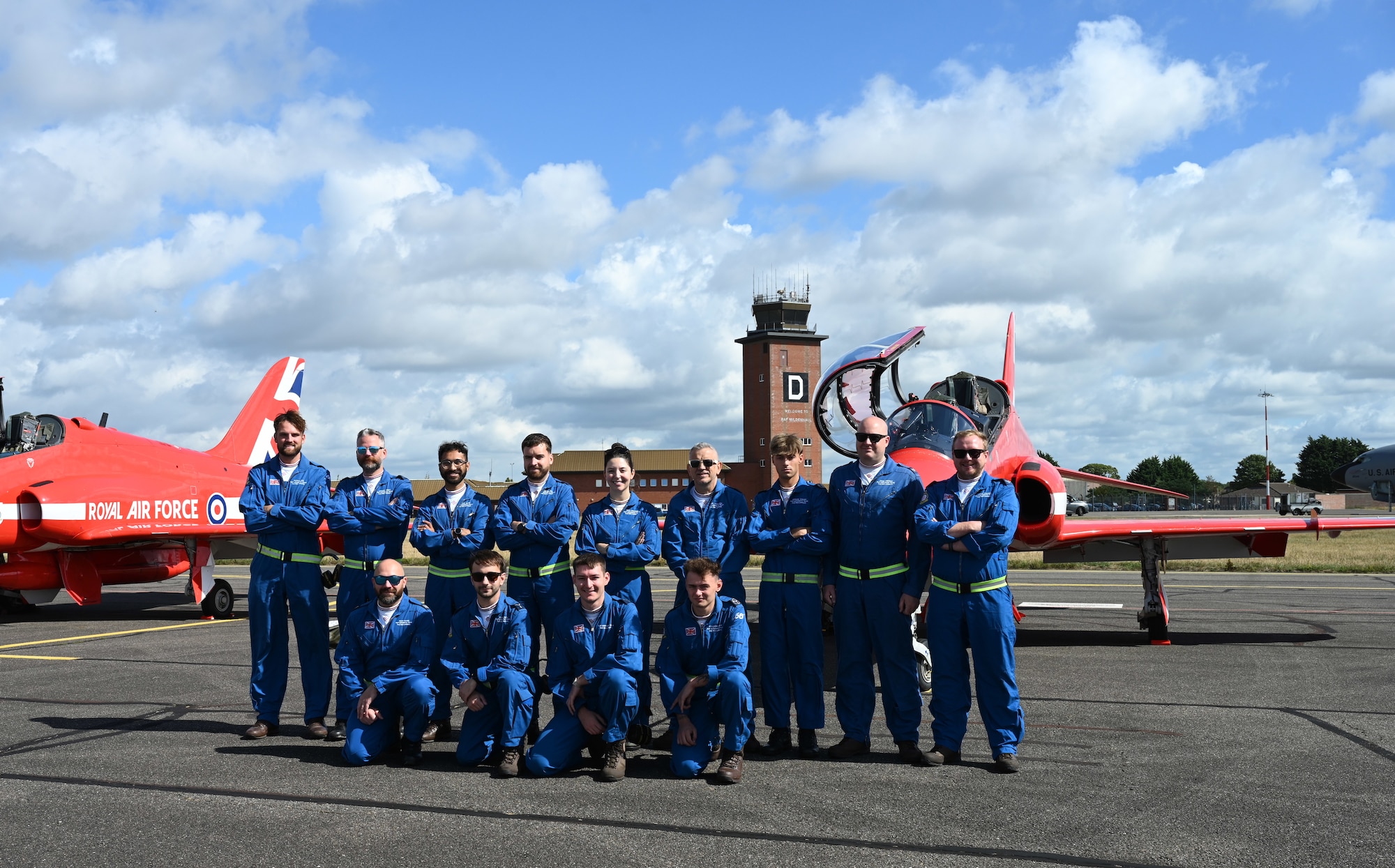 Members of “Circus,” the traveling support crew of the Royal Air Force Aerobatic Team, the Red Arrows, pose for a photo at RAF Mildenhall, England, Aug. 28, 2026. The Circus support crew – known as Circus 1 to 11, denoting which pilot they fly with – are hand-picked each year and fly in the rear seats of the jets during the season. (U.S. Air Force photo by Karen Abeyasekere)