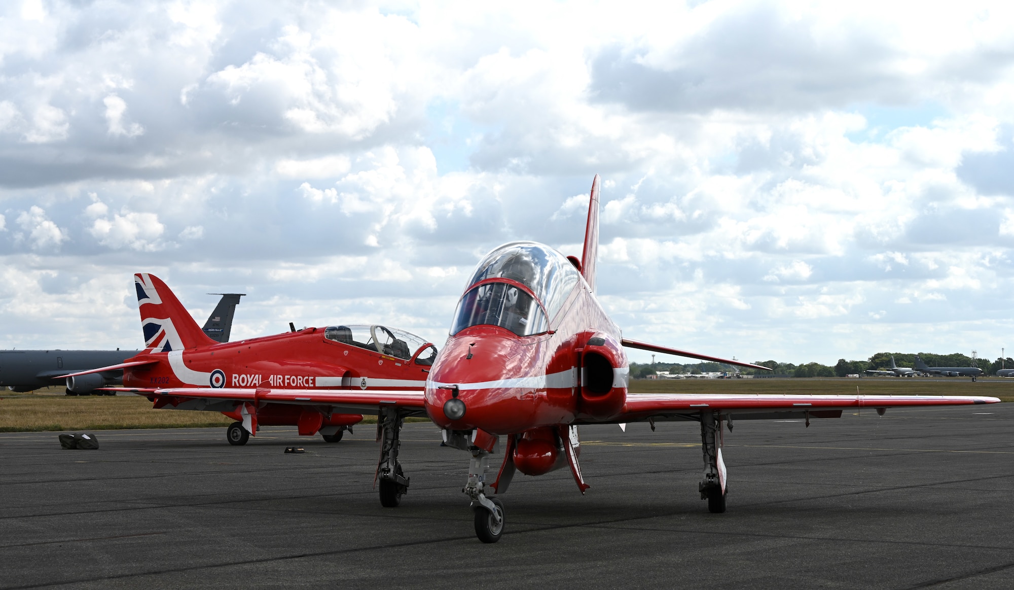 Hawk T1 aircraft with the Royal Air Force Aerobatic Team, the Red Arrows, taxi along the flight line on the way out to perform at an aerial display on the Essex coast at RAF Mildenhall, England, Aug. 28, 2026. Team Mildenhall provided a wide range of support to the team during their flying visit as they performed at air shows around the UK. (U.S. Air Force photo by Karen Abeyasekere)