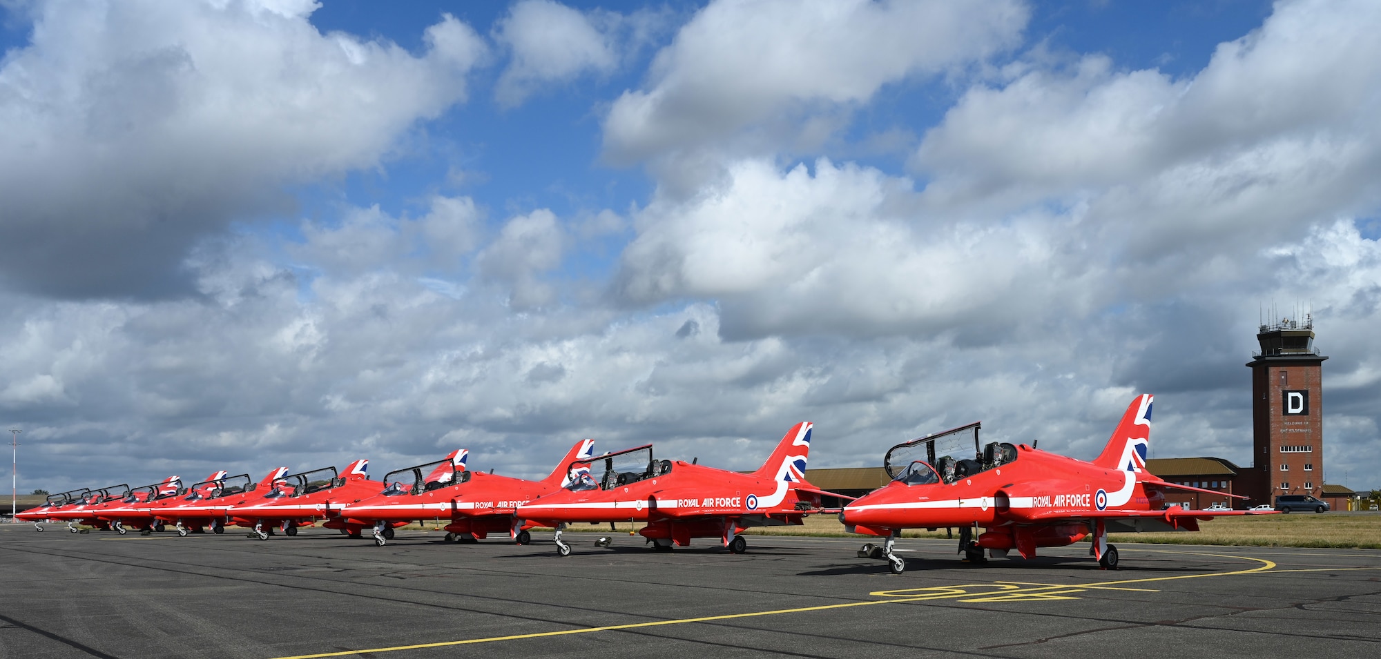 Hawk T1 aircraft with the Royal Air Force Aerobatic Team, the Red Arrows, sit on the flight line at RAF Mildenhall, England, Aug. 28, 2026. The Red Arrows team stopped by RAF Mildenhall between performances at multiple air shows throughout the U.K. (U.S. Air Force photo by Karen Abeyasekere)